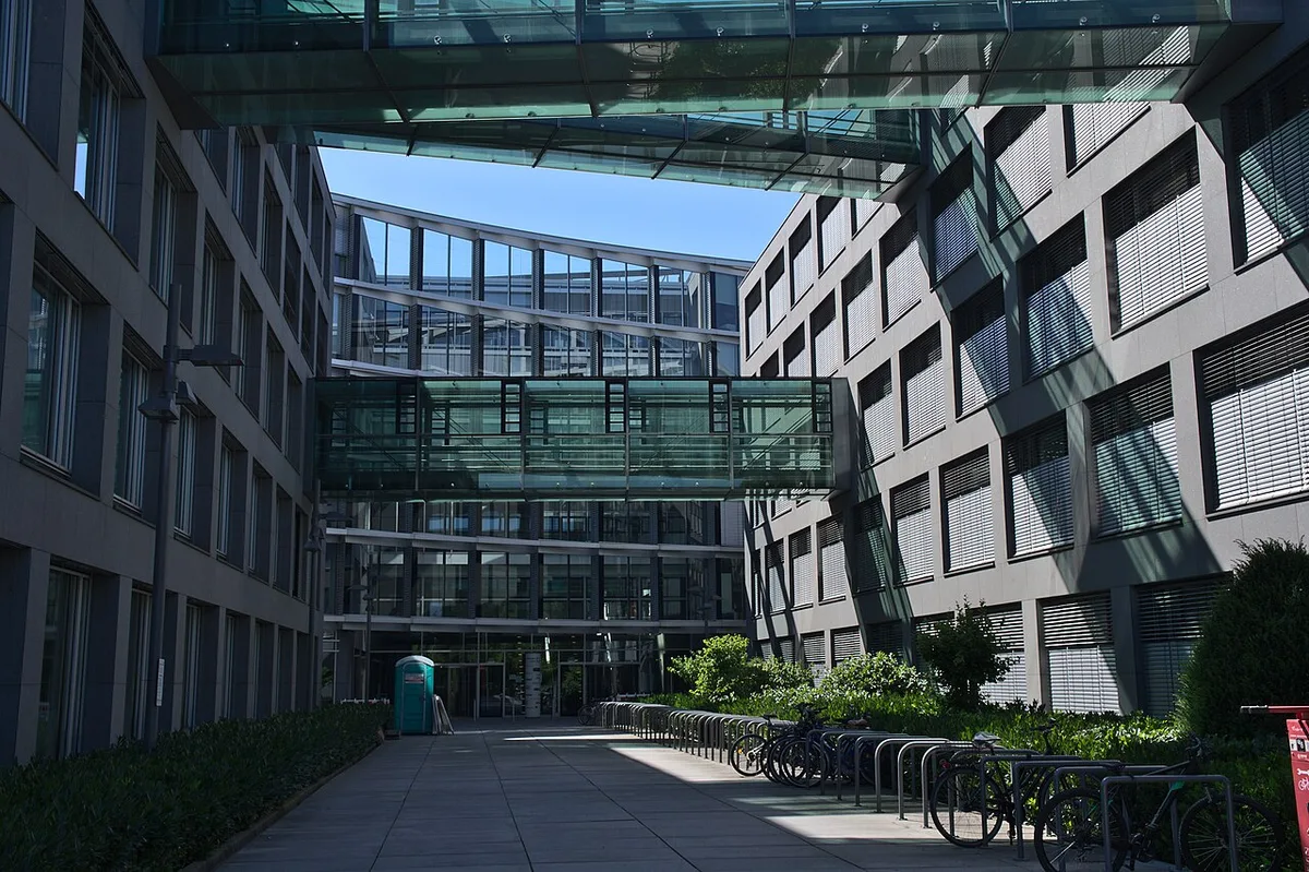 Modern office buildings reflecting the sky, representing international business